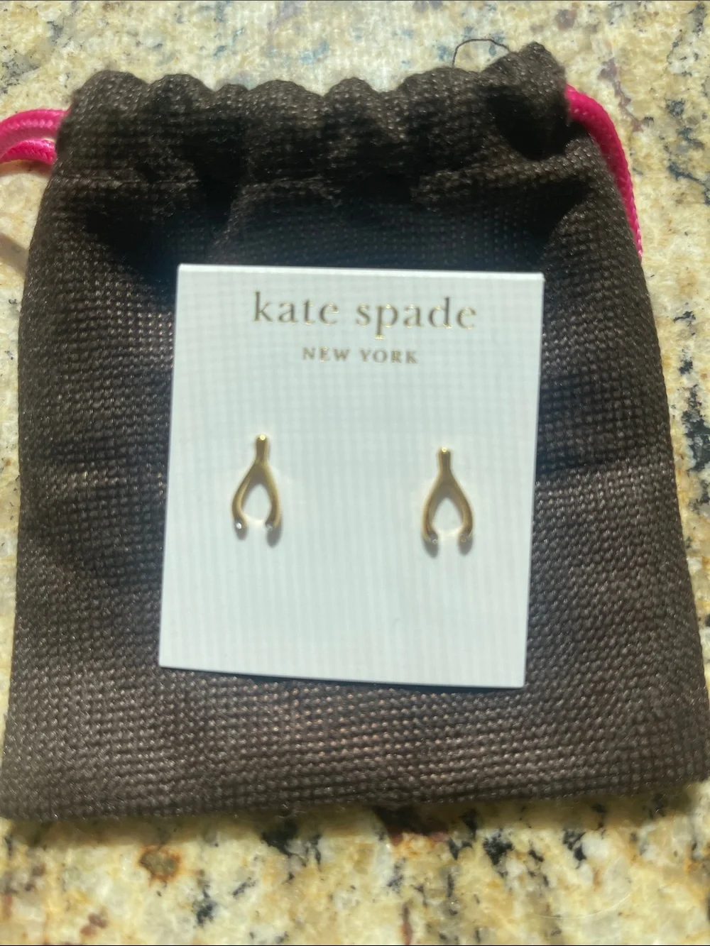 kate spade gold wishbone stud earrings with “diamond” details